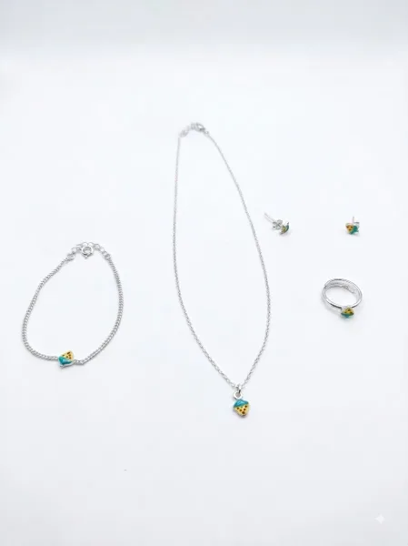 The Petite Acorn Collection with earrings and pandet and bracelet and ring
